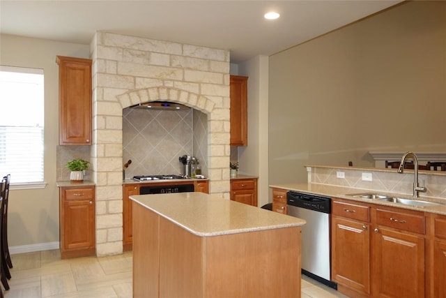 3707 Tall Cedars Rd, Cedar Park, TX 78613 - kitchen featuring appliances with stainless steel finishes, tasteful backsplash, a center island, brown cabinetry, and recessed lighting