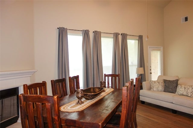 3707 Tall Cedars Rd, Cedar Park, TX 78613 - dining space featuring wood finished floors and a towering ceiling