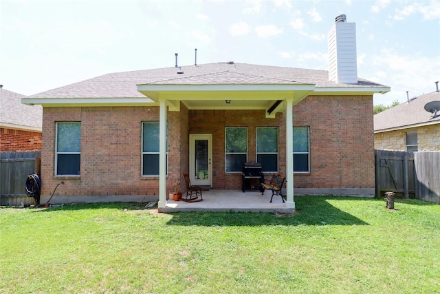 3707 Tall Cedars Rd, Cedar Park, TX 78613 - back of house featuring a patio, a fenced backyard, a chimney, and brick siding