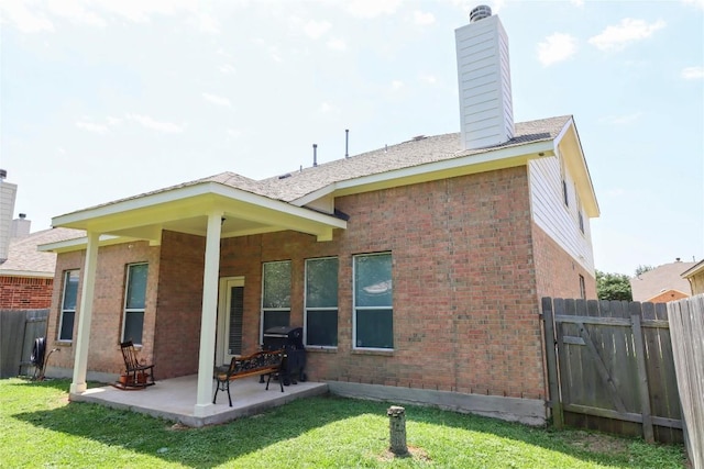 3707 Tall Cedars Rd, Cedar Park, TX 78613 - back of house featuring a chimney, brick siding, and a patio