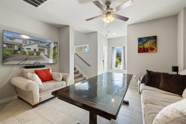 9502 Whisper Willow Blvd, Manor, TX 78653 - living room with stairs, light tile patterned floors, ceiling fan, baseboards, and recessed lighting