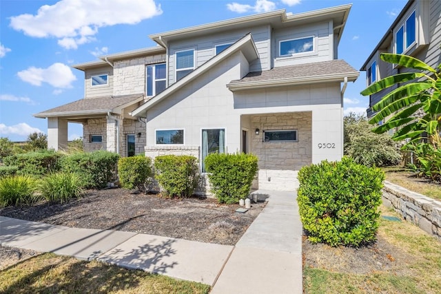 9502 Whisper Willow Blvd, Manor, TX 78653 - view of front of house with stone siding and a shingled roof