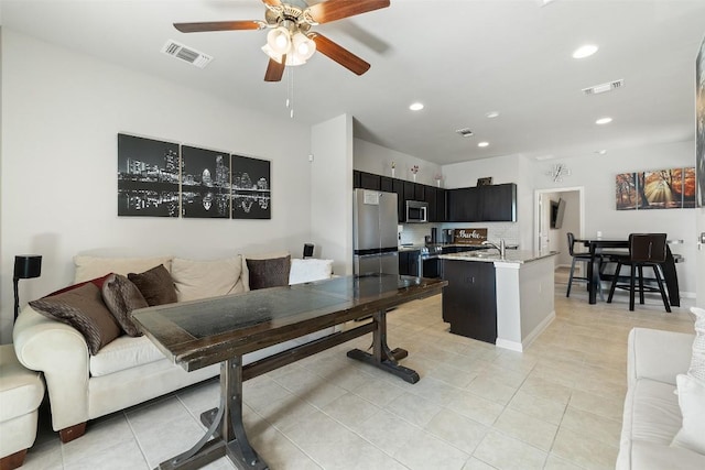 9502 Whisper Willow Blvd, Manor, TX 78653 - living area featuring ceiling fan, light tile patterned floors, and recessed lighting