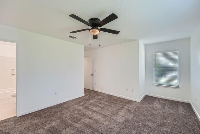 12404 Campana Dr, Del Valle, TX 78617 - carpeted empty room with ceiling fan and baseboards