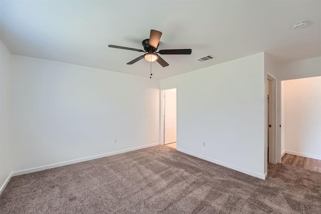 12404 Campana Dr, Del Valle, TX 78617 - spare room with a smoke detector, carpet, and ceiling fan