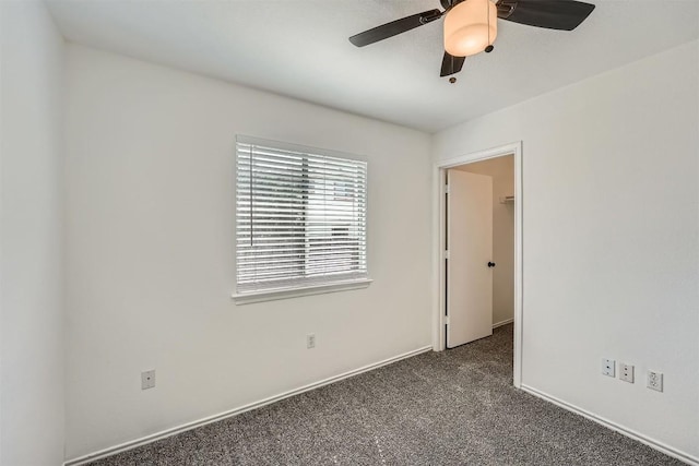 12404 Campana Dr, Del Valle, TX 78617 - spare room with dark carpet and ceiling fan