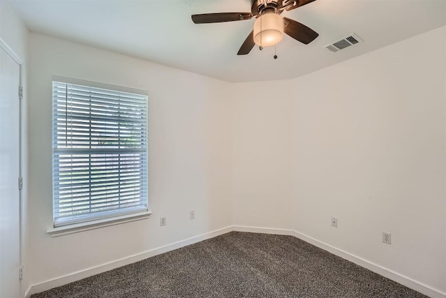 12404 Campana Dr, Del Valle, TX 78617 - spare room featuring dark colored carpet and a ceiling fan