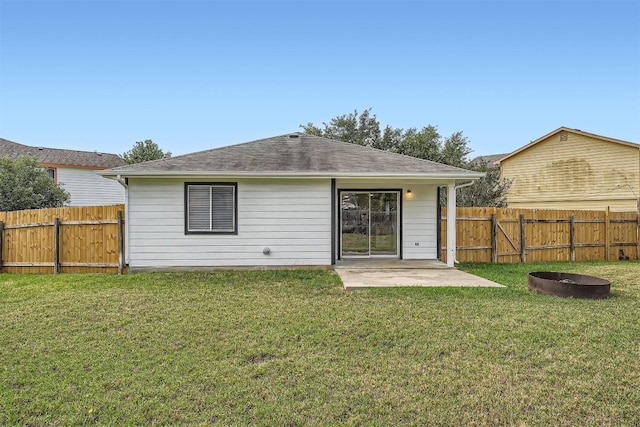 12404 Campana Dr, Del Valle, TX 78617 - back of house featuring a fenced backyard, a patio, a shingled roof, and an outdoor fire pit