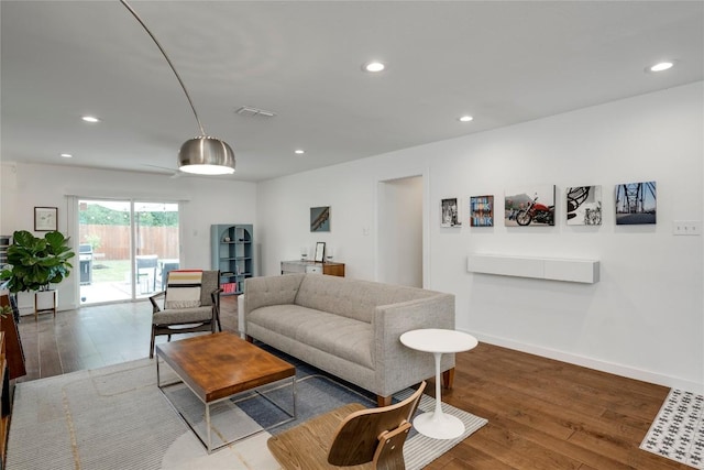 5205 Gladstone Dr, Austin, TX 78723 - living room with hardwood / wood-style floors, recessed lighting, and baseboards