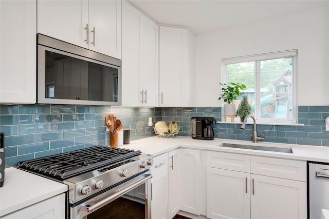5205 Gladstone Dr, Austin, TX 78723 - kitchen with appliances with stainless steel finishes, a sink, and white cabinets
