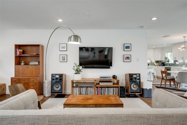 5205 Gladstone Dr, Austin, TX 78723 - living room with wood finished floors, recessed lighting, and a chandelier