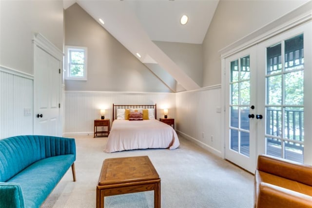 2113 Brooklyn St, Austin, TX 78704 - bedroom featuring vaulted ceiling, a wainscoted wall, carpet, french doors, and access to outside