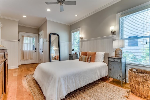 2113 Brooklyn St, Austin, TX 78704 - bedroom with a wainscoted wall, light wood-style flooring, multiple windows, recessed lighting, and ceiling fan