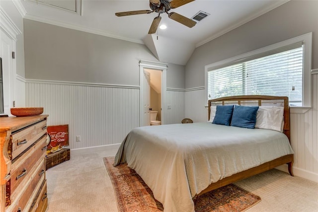 2113 Brooklyn St, Austin, TX 78704 - bedroom with light carpet, ceiling fan, a wainscoted wall, vaulted ceiling, and crown molding