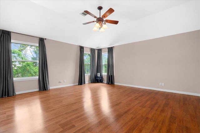 509 Oak Park Dr, Round Rock, TX 78681 - empty room featuring wood finished floors, ceiling fan, baseboards, and lofted ceiling