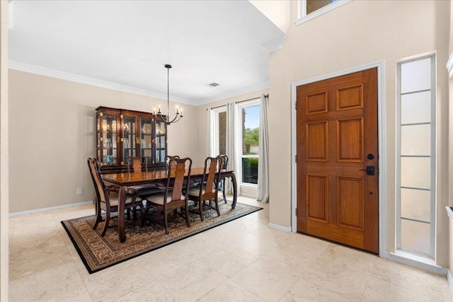 509 Oak Park Dr, Round Rock, TX 78681 - dining room with a chandelier, ornamental molding, and baseboards