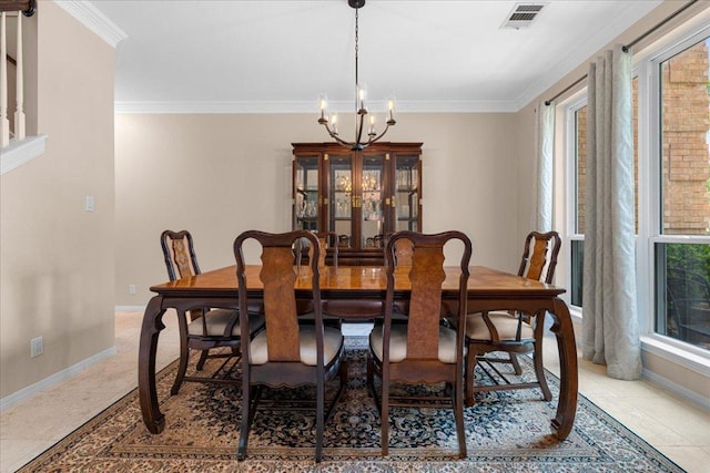 509 Oak Park Dr, Round Rock, TX 78681 - dining area with ornamental molding, a chandelier, light tile patterned floors, and baseboards