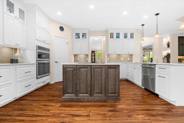 509 Oak Park Dr, Round Rock, TX 78681 - kitchen featuring appliances with stainless steel finishes, plenty of natural light, dark wood-style floors, light countertops, and recessed lighting