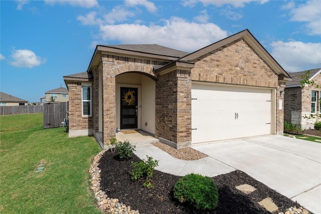1003 Ascari Ct, Hutto, TX 78634 - view of front of house with an attached garage, brick siding, driveway, and roof with shingles