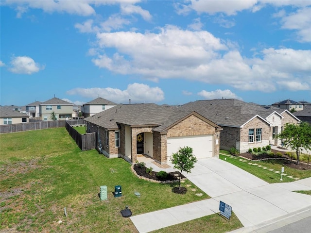 1003 Ascari Ct, Hutto, TX 78634 - view of front facade featuring brick siding, driveway, an attached garage, and a residential view