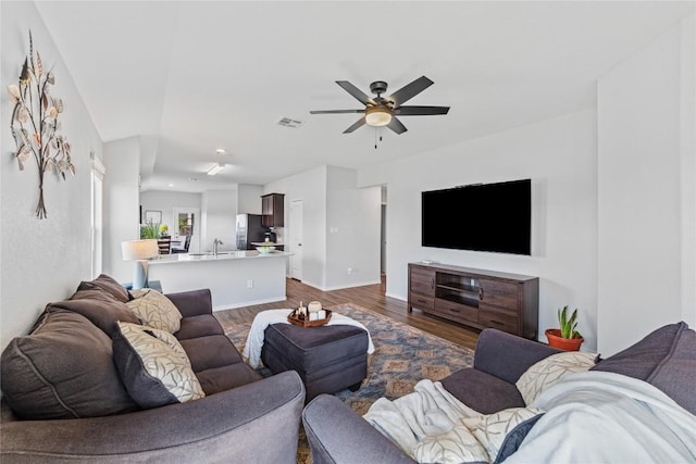 1003 Ascari Ct, Hutto, TX 78634 - living room with ceiling fan, dark wood-style flooring, baseboards, and recessed lighting