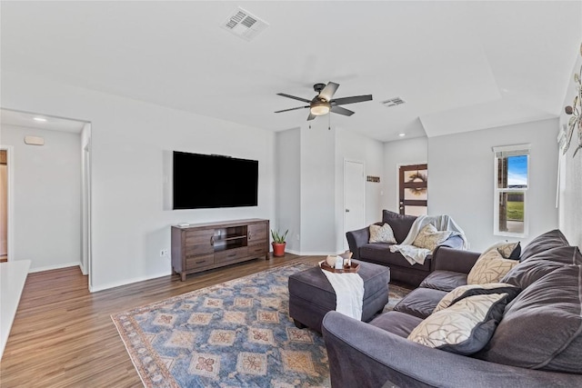 1003 Ascari Ct, Hutto, TX 78634 - living room with wood finished floors, ceiling fan, baseboards, and recessed lighting