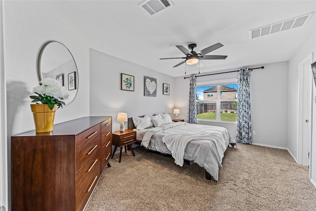 1003 Ascari Ct, Hutto, TX 78634 - bedroom featuring light carpet, baseboards, and a ceiling fan