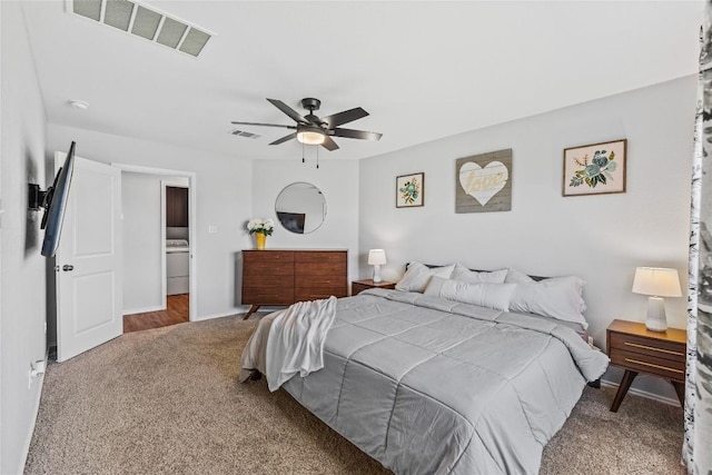 1003 Ascari Ct, Hutto, TX 78634 - carpeted bedroom with a ceiling fan, washer / dryer, and baseboards