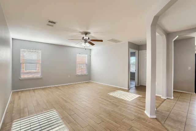 9001 China Rose Dr, Austin, TX 78724 - spare room with a ceiling fan, light wood-style floors, and baseboards