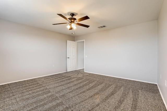 9001 China Rose Dr, Austin, TX 78724 - unfurnished room with a ceiling fan, dark colored carpet, and baseboards