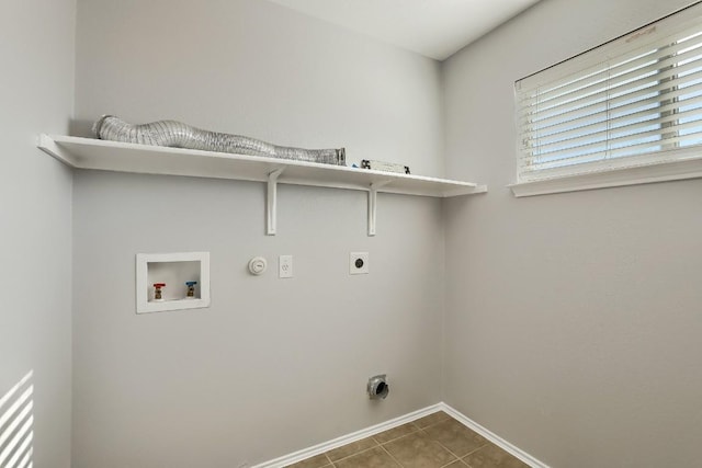 9001 China Rose Dr, Austin, TX 78724 - washroom with electric dryer hookup, baseboards, hookup for a gas dryer, washer hookup, and tile patterned flooring