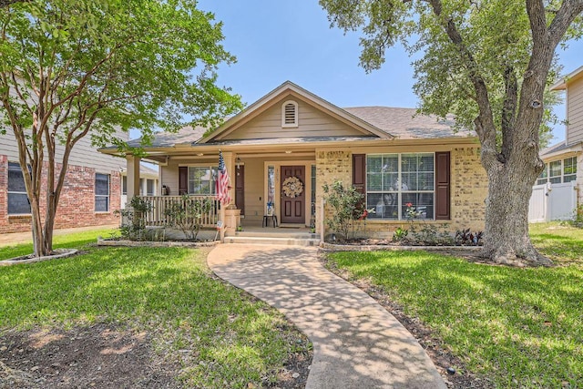 1007 Big Spring Dr, Cedar Park, TX 78613 - ranch-style house featuring a porch, a front yard, and brick siding