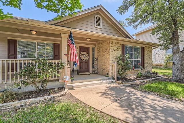 1007 Big Spring Dr, Cedar Park, TX 78613 - doorway to property with covered porch and brick siding