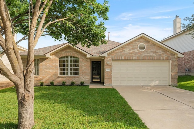 2305 Boulder Run, Georgetown, TX 78626 - single story home with concrete driveway, a shingled roof, brick siding, a garage, and a front yard