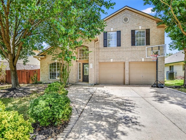 4109 Moss Hollow Dr, Round Rock, TX 78681 - traditional-style house with brick siding, concrete driveway, an attached garage, and cooling unit