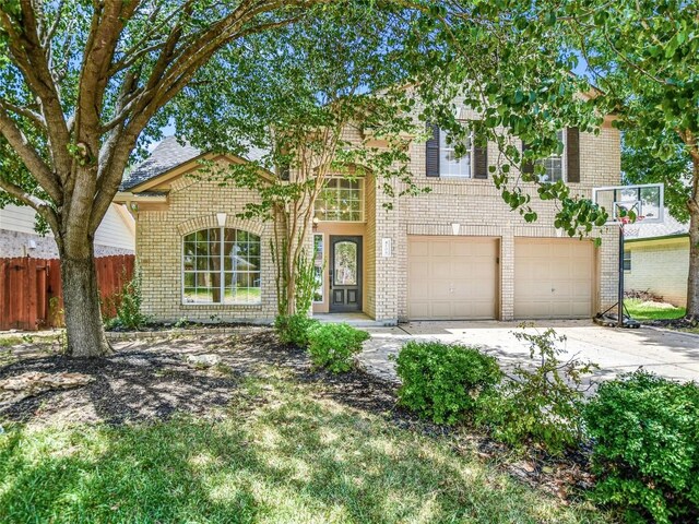 4109 Moss Hollow Dr, Round Rock, TX 78681 - view of front facade with brick siding, concrete driveway, and a garage