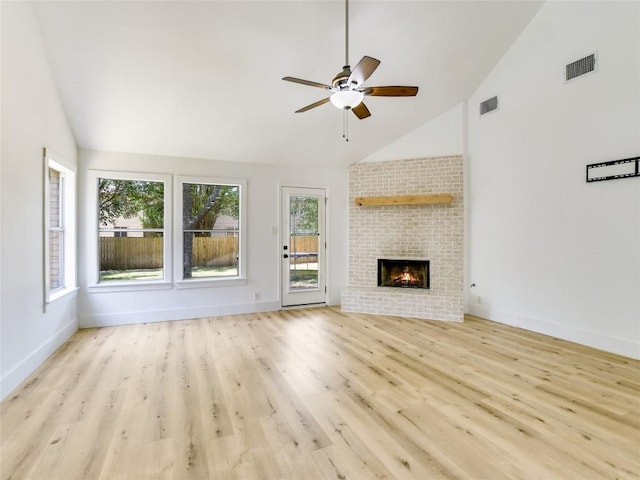 4109 Moss Hollow Dr, Round Rock, TX 78681 - unfurnished living room with wood finished floors, ceiling fan, a fireplace, high vaulted ceiling, and baseboards