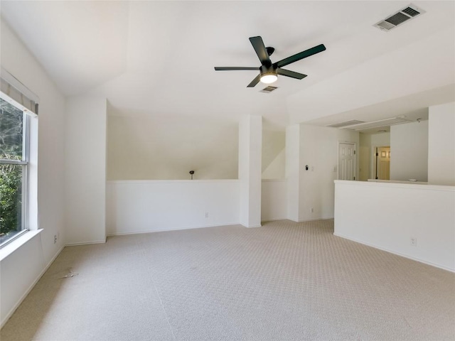 4109 Moss Hollow Dr, Round Rock, TX 78681 - spare room featuring light colored carpet, a ceiling fan, lofted ceiling, and baseboards