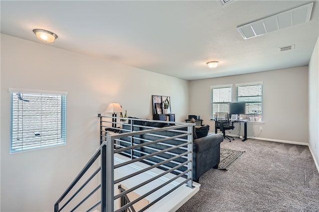 10317 Laurie Ln, Austin, TX 78747 - carpeted living area featuring an office area and baseboards