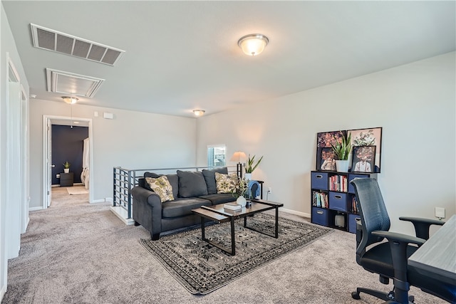 10317 Laurie Ln, Austin, TX 78747 - carpeted living area with attic access, an office area, and baseboards