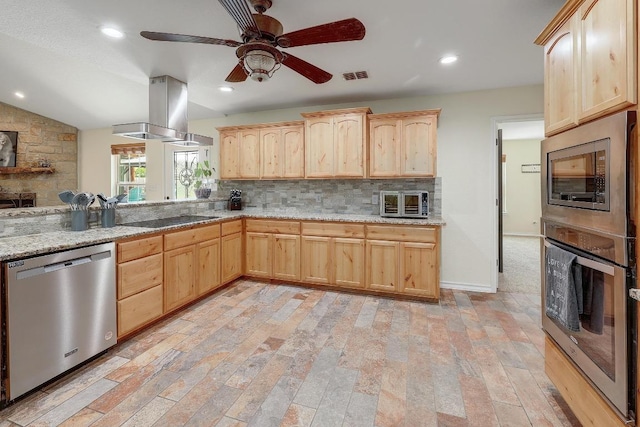 20217 Engelmann Ln, Manor, TX 78653 - kitchen with stainless steel appliances, light brown cabinets, island range hood, decorative backsplash, and a ceiling fan