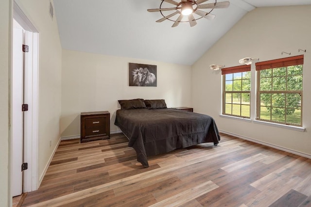 20217 Engelmann Ln, Manor, TX 78653 - bedroom featuring vaulted ceiling, wood finished floors, baseboards, and ceiling fan