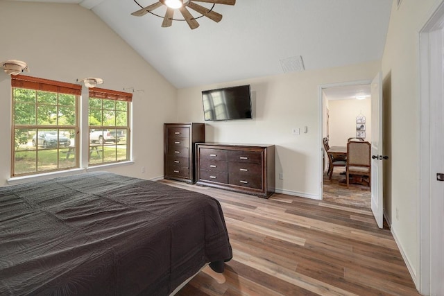 20217 Engelmann Ln, Manor, TX 78653 - bedroom featuring light wood-style floors, baseboards, ceiling fan, and high vaulted ceiling
