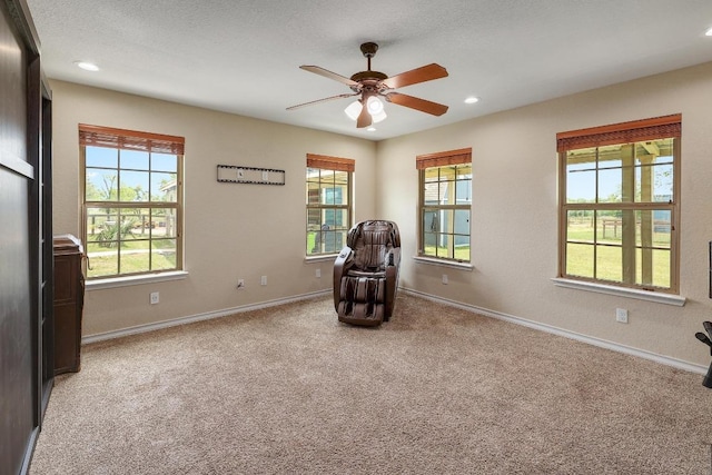 20217 Engelmann Ln, Manor, TX 78653 - sitting room with light carpet, baseboards, a ceiling fan, and recessed lighting