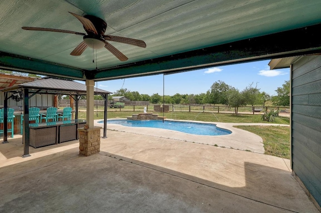 20217 Engelmann Ln, Manor, TX 78653 - view of swimming pool with a gazebo, ceiling fan, a fenced backyard, a patio area, and a jacuzzi