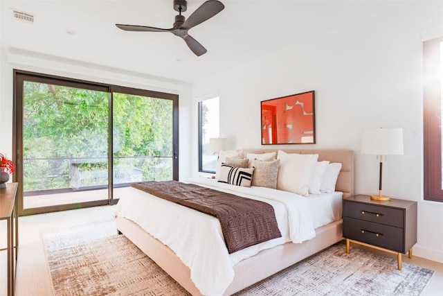 2807 Garwood St, Austin, TX 78702 - bedroom featuring access to exterior, multiple windows, and ceiling fan