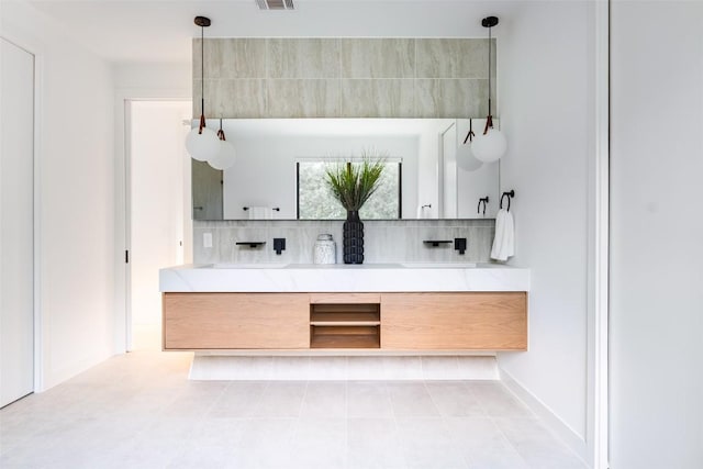 2807 Garwood St, Austin, TX 78702 - kitchen with backsplash, open shelves, light countertops, decorative light fixtures, and tile patterned flooring
