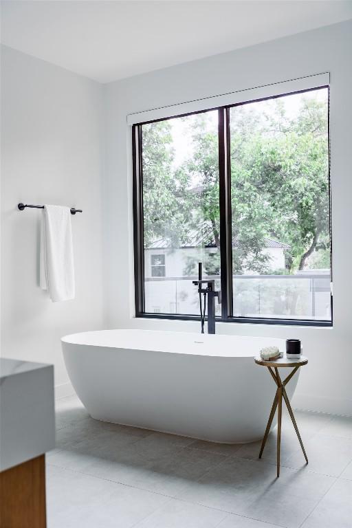 2807 Garwood St, Austin, TX 78702 - full bath with a freestanding bath, tile patterned floors, and vanity