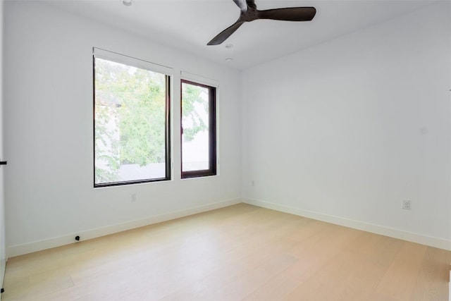 2807 Garwood St, Austin, TX 78702 - unfurnished room with light wood-style flooring, a ceiling fan, and baseboards