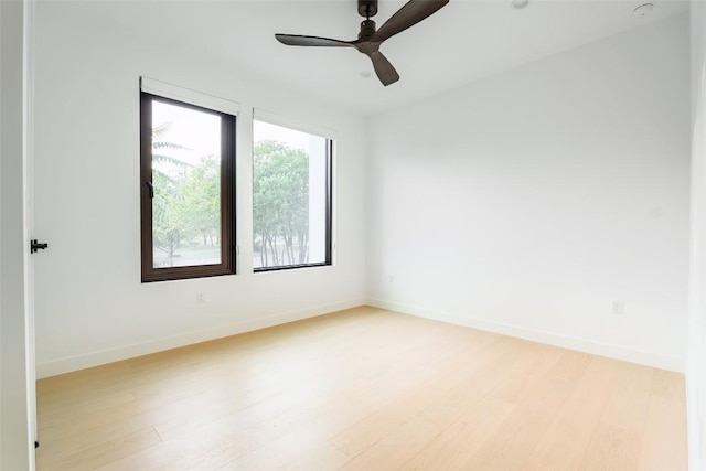 2807 Garwood St, Austin, TX 78702 - empty room with light wood-style flooring, baseboards, and a ceiling fan